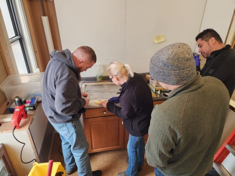 Team collaborating on a woodworking project.