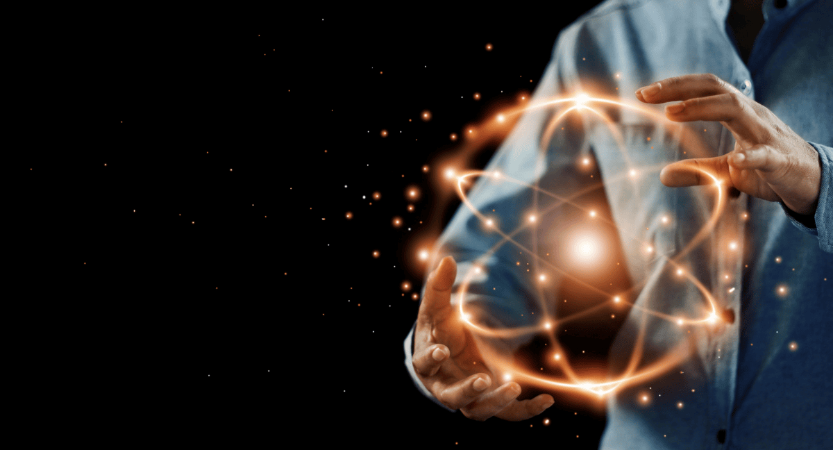 Hands manipulating glowing digital sphere.