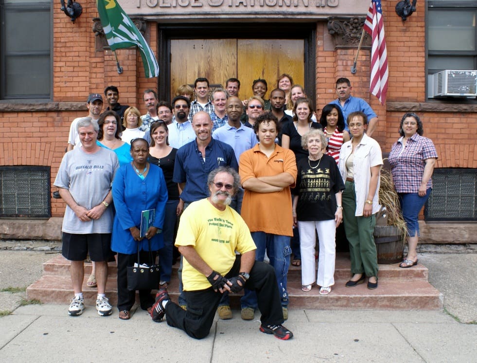 Community group gathered outside a police station.